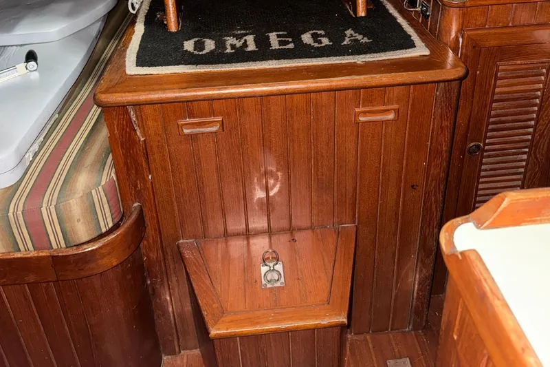 Slide: The Image of Wooden interior of 1984 Young Sun 35 sailboat with black countertop. - 14