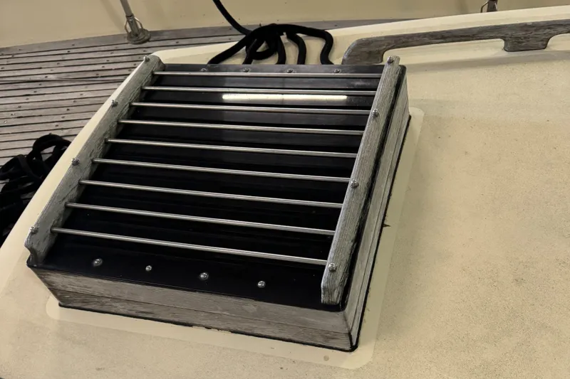 Slide: The Image of Steering wheel of a 1984 Young Sun 35 sailboat, featuring classic nautical design. - 6