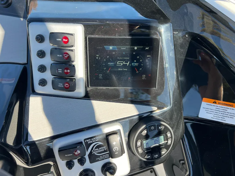 Slide: The Image of Dashboard of 2025 Yamaha Boats AR220, featuring digital display and control panel. - 15