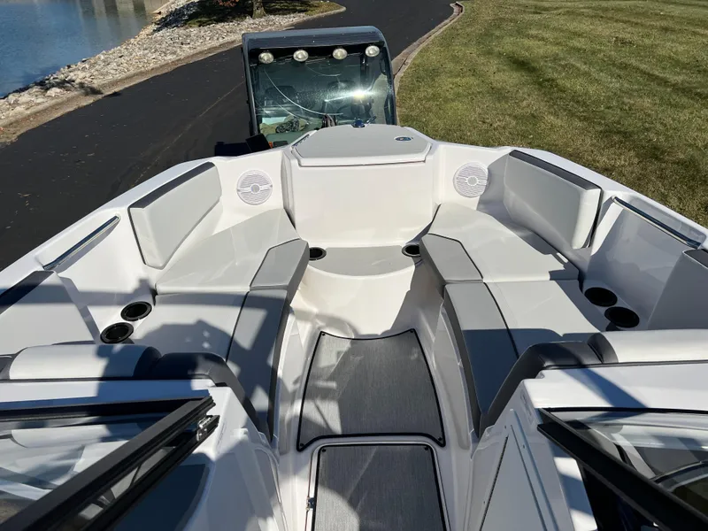 Slide: The Image of 2025 Yamaha Boats AR220 interior with sleek seating and modern design. - 16