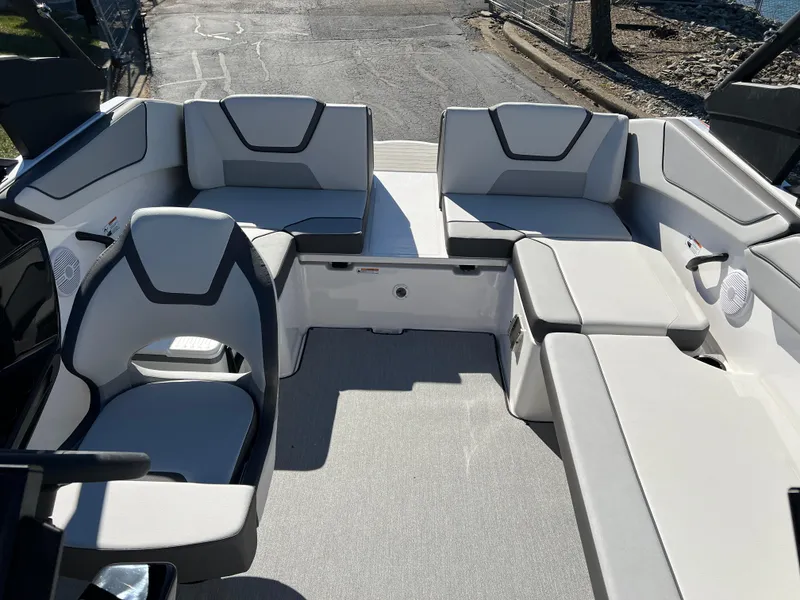 Slide: The Image of 2025 Yamaha Boats AR220 interior with modern seating and sleek design. - 20