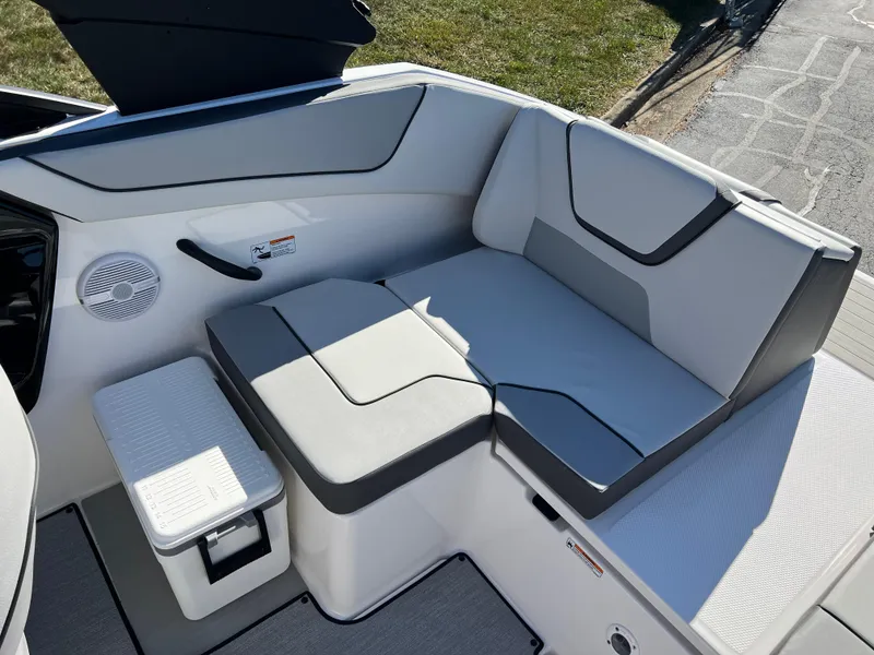 Slide: The Image of 2025 Yamaha Boats AR220 interior seating with modern design and storage. - 22