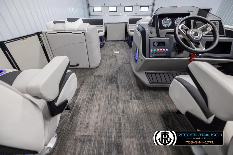 Slide: The Image of Interior of 2025 Avalon Catalina QL boat with modern seating and steering console. - 17