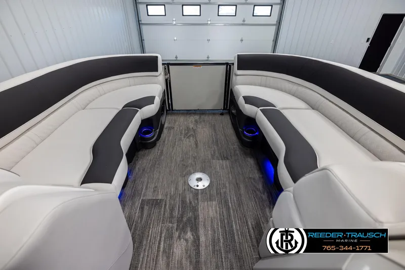 Slide: The Image of 2025 Avalon Catalina QL interior with modern seating and ambient lighting in a showroom. - 18