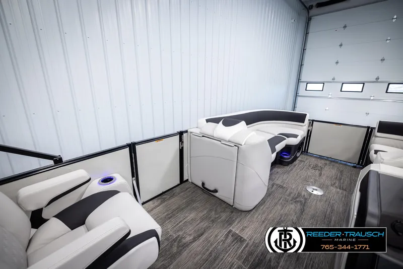 Slide: The Image of 2025 Avalon Catalina QL interior with plush seating and modern design in a showroom. - 21