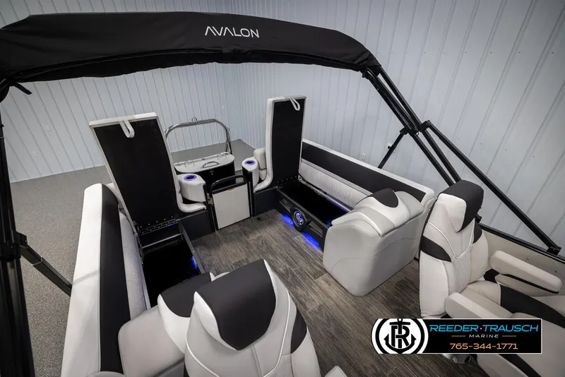 Slide: The Image of 2025 Avalon Catalina QL boat interior with modern seating and blue LED lighting. - 24