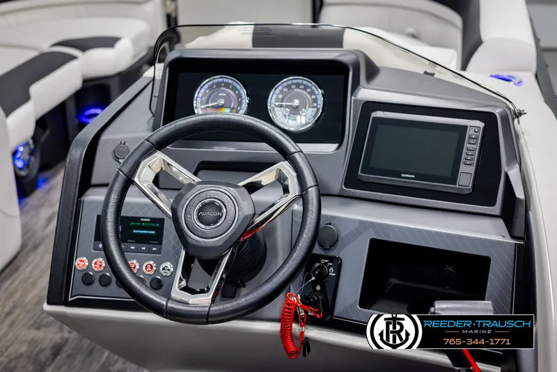 Slide: The Image of 2025 Avalon Catalina QL boat dashboard with steering wheel and digital display. - 27