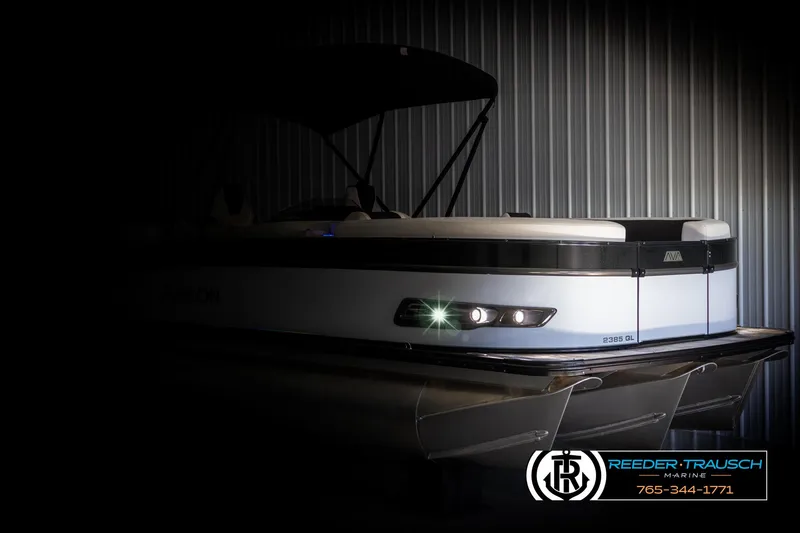Slide: The Image of 2025 Avalon Catalina QL pontoon boat in dimly lit storage. - 4