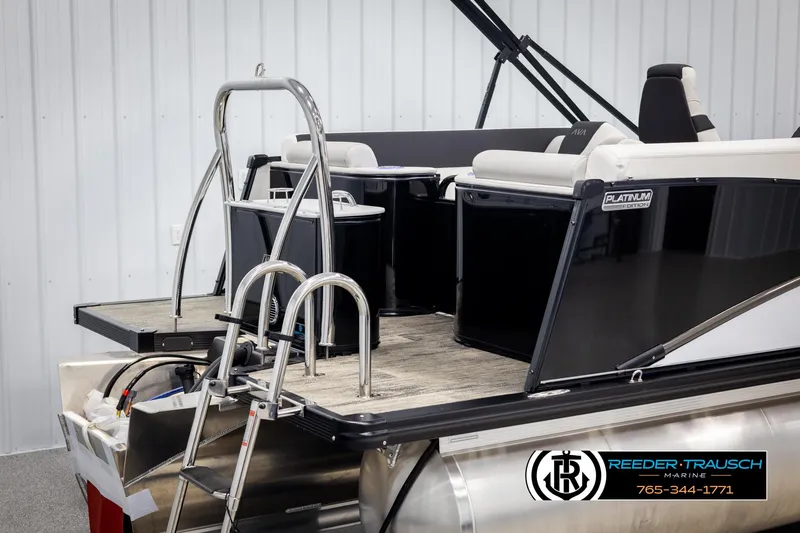 Slide: The Image of 2025 Avalon Catalina QL pontoon boat with ladder and seating, displayed indoors. - 41
