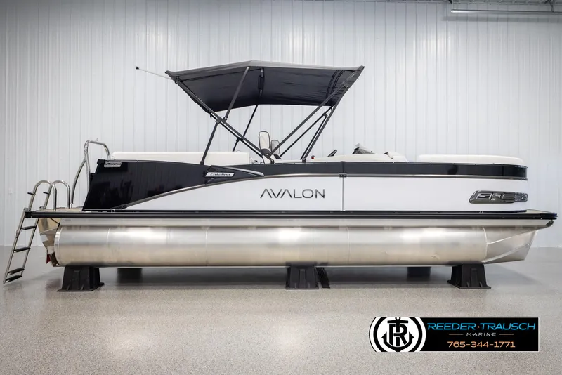 Slide: The Image of 2025 Avalon Catalina QL pontoon boat with canopy in showroom. - 5
