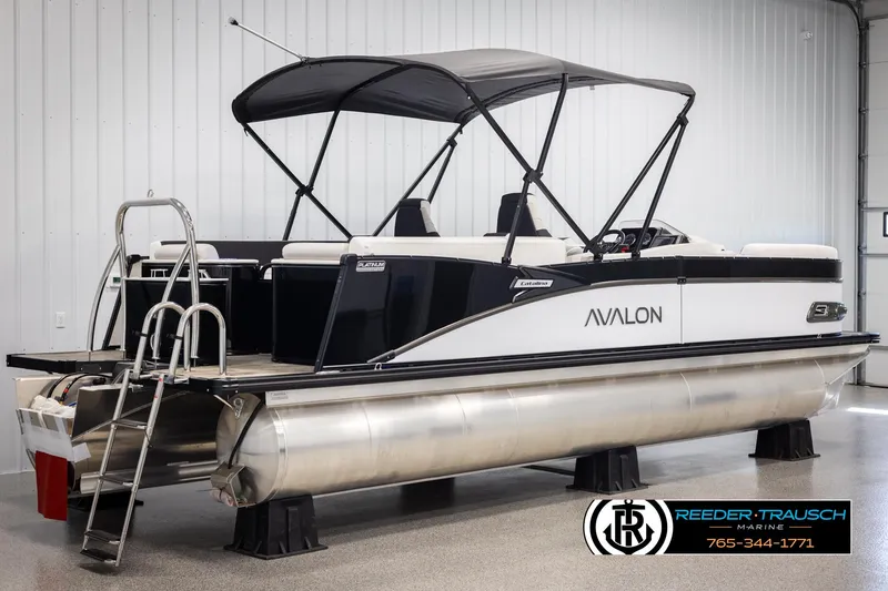 Slide: The Image of 2025 Avalon Catalina QL pontoon boat with canopy in showroom. - 6