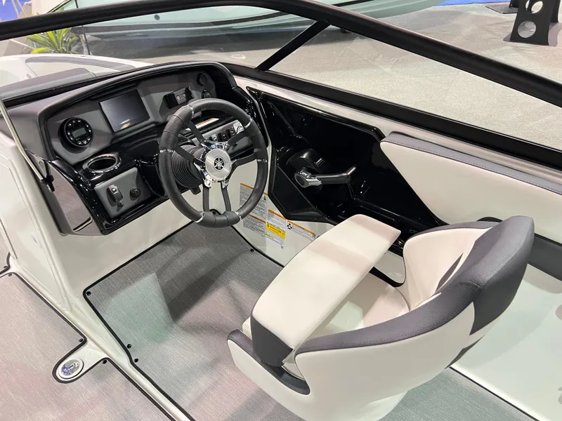 Slide: The Image of 2025 Yamaha Boats AR195 interior with modern dashboard and steering wheel. - 6