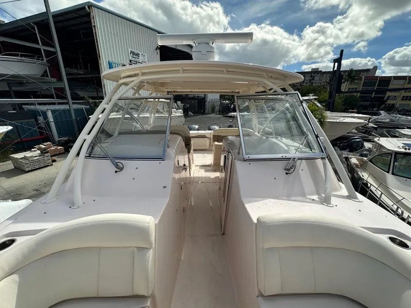 Slide: The Image of 2014 Grady-White Freedom 335 boat with open cockpit and dual consoles. - 13