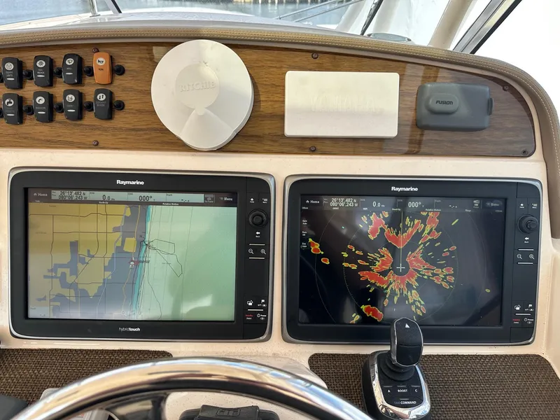 Slide: The Image of Dashboard of 2014 Grady-White Freedom 335 with dual Raymarine navigation screens. - 27