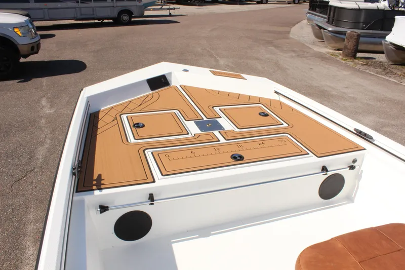 Slide: The Image of 2025 Avid 18 Rogue CC boat deck with storage compartments and non-slip surface. - 15