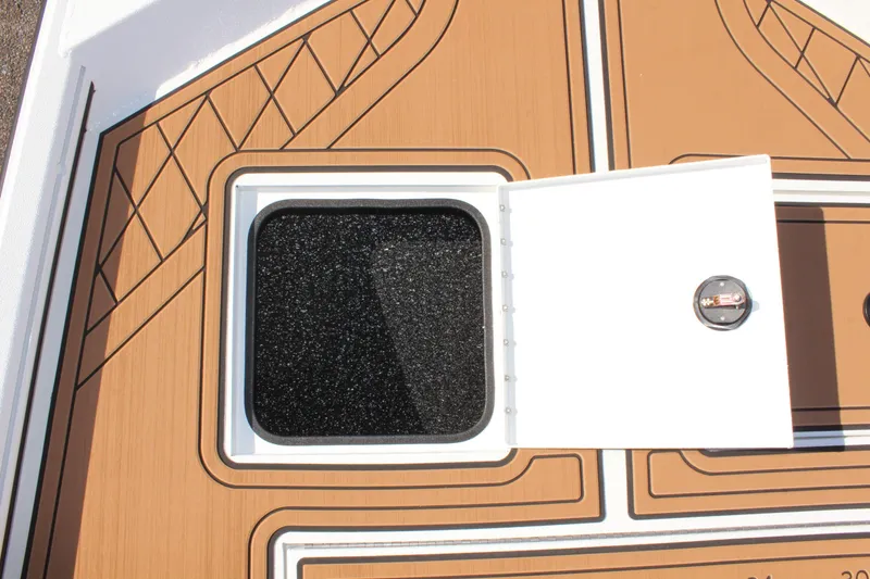 Slide: The Image of Avid 18 Rogue CC 2025 boat hatch with open storage compartment. - 18