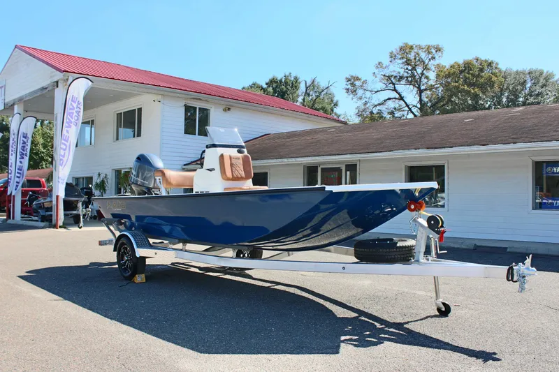 Slide: The Image of 2025 Avid 18 Rogue CC boat on trailer outside dealership. - 3