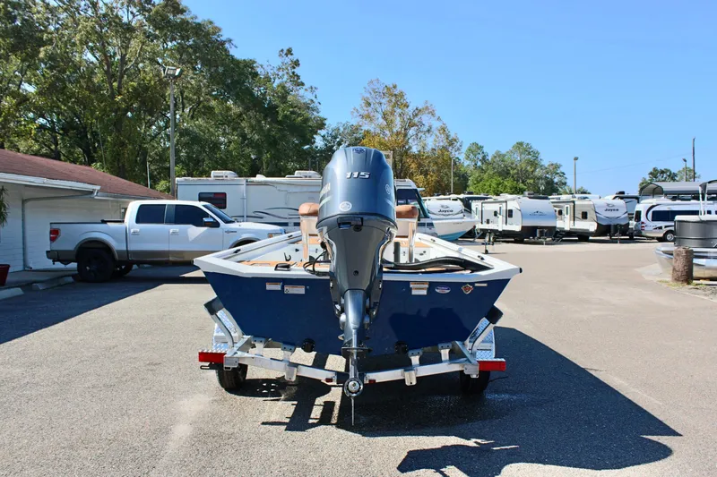 Slide: The Image of Avid 18 Rogue CC 2025 boat on trailer in parking lot. - 6
