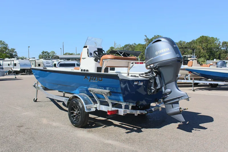 Slide: The Image of 2025 Avid 18 Rogue CC boat with Yamaha engine on trailer in parking lot. - 7