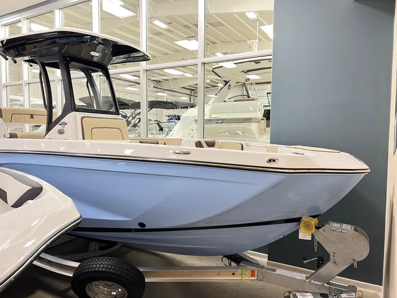 The Image of 2025 Yamaha Boats 222 FSH Sport E in showroom, side view. - 0
