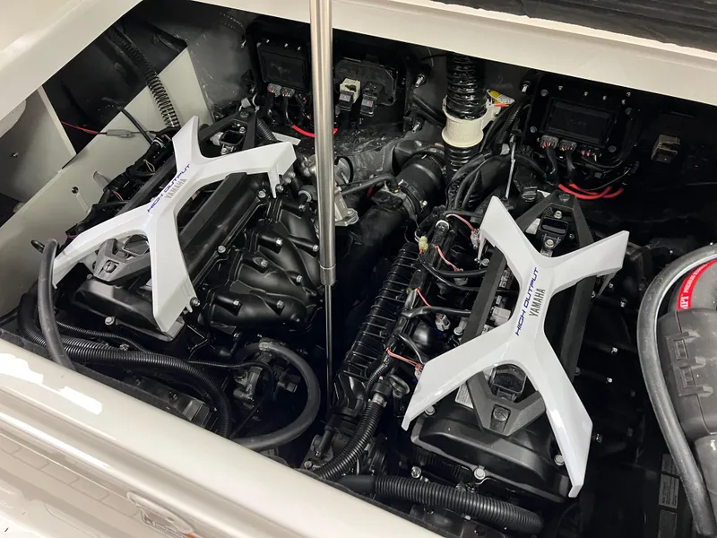 Slide: The Image of 2025 Yamaha Boats 222 FSH Sport E engine compartment with dual engines. - 13