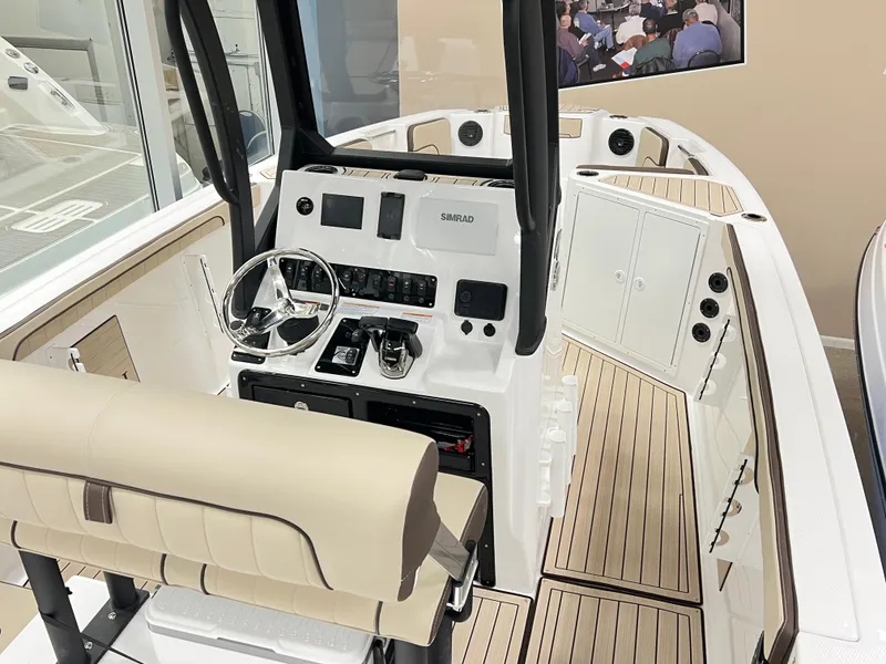 Slide: The Image of 2025 Yamaha Boats 222 FSH Sport E interior with modern helm and seating. - 3