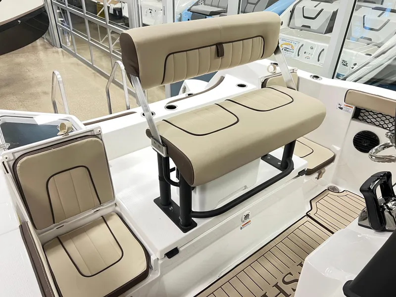 Slide: The Image of 2025 Yamaha Boats 222 FSH Sport E interior seating with beige upholstery and modern design. - 4