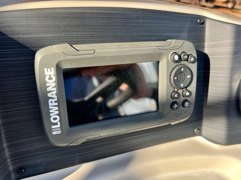 Slide: The Image of Lowrance GPS device on 2023 Cypress Cay Seabreeze 232 dashboard. - 14