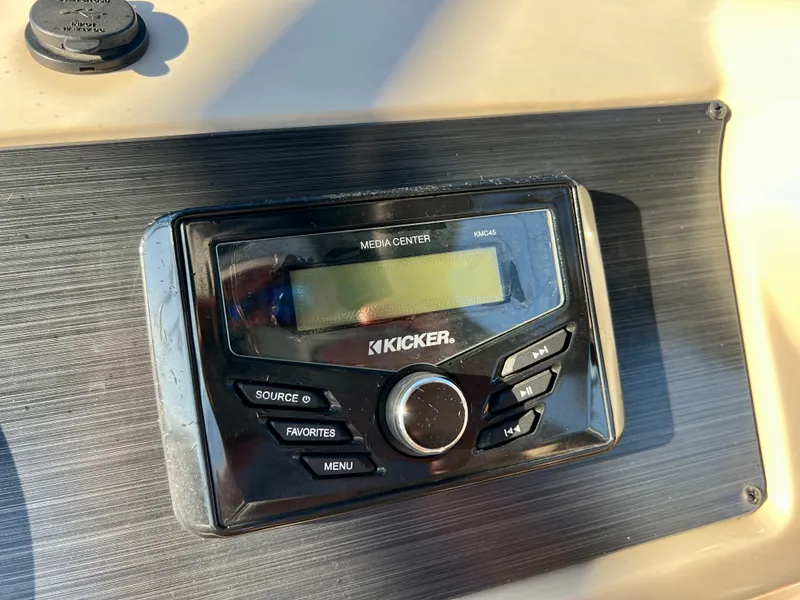 Slide: The Image of Kicker media center on 2023 Cypress Cay Seabreeze 232 boat dashboard. - 17
