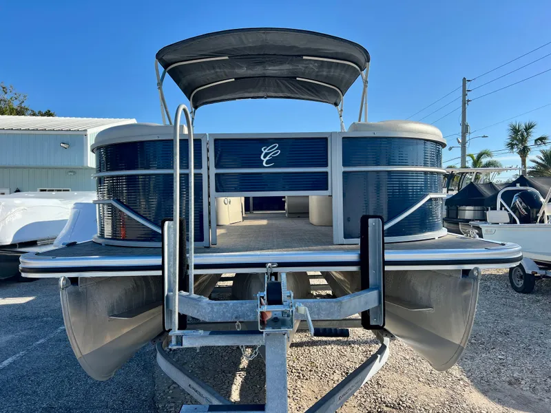 Slide: The Image of 2023 Cypress Cay Seabreeze 232 pontoon boat on trailer, sunny day. - 2