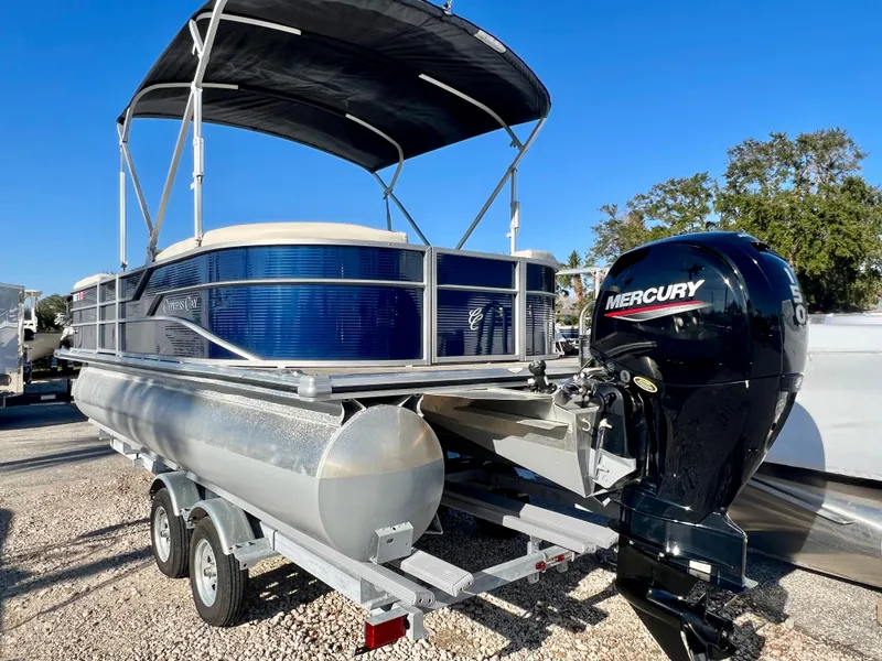 Slide: The Image of 2023 Cypress Cay Seabreeze 232 pontoon boat with Mercury outboard engine on trailer. - 5