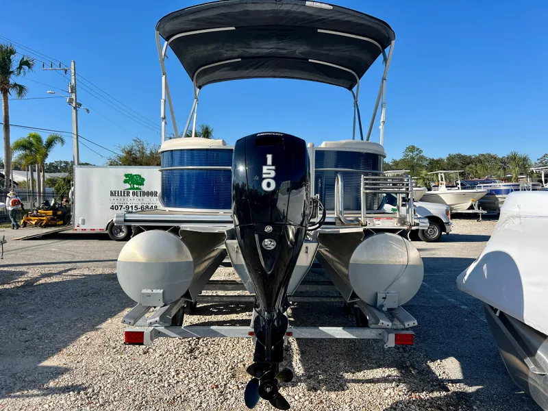 Slide: The Image of 2023 Cypress Cay Seabreeze 232 pontoon boat with 150 HP engine on trailer. - 6