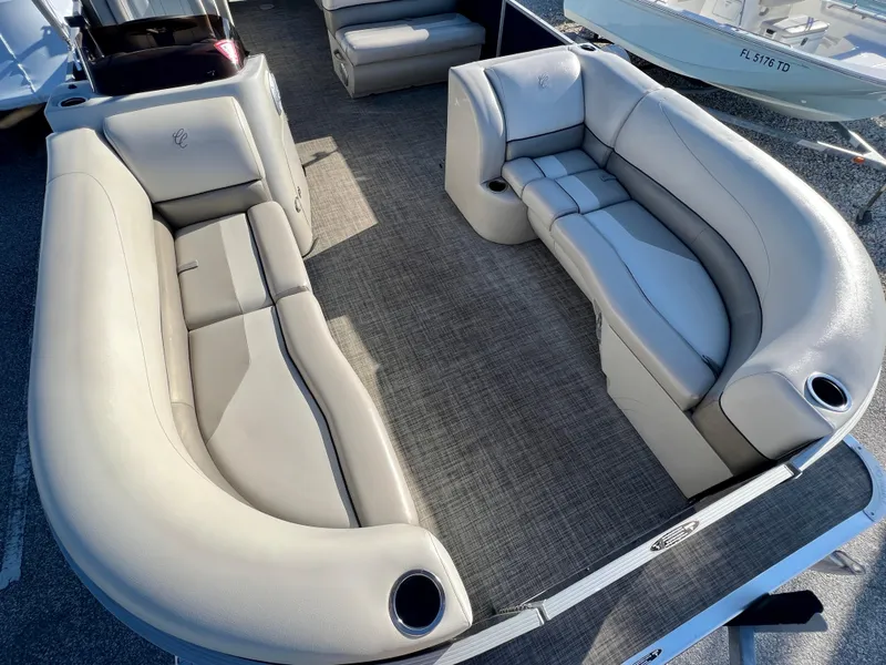 Slide: The Image of 2023 Cypress Cay Seabreeze 232 pontoon boat interior with plush seating and cup holders. - 7