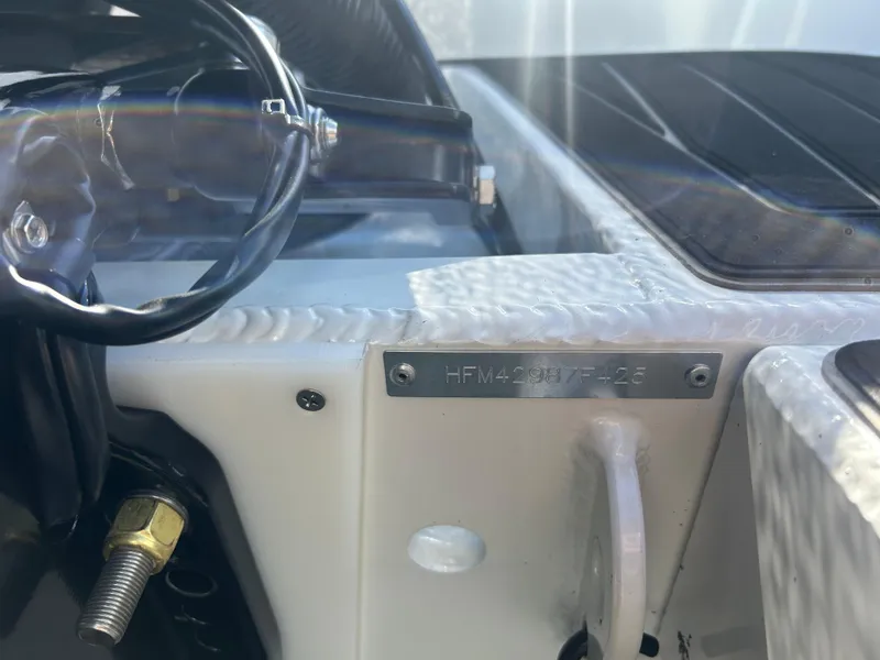 Slide: The Image of Interior of 2025 Highfield Sport 520 Rib with steering wheel and seating. - 13