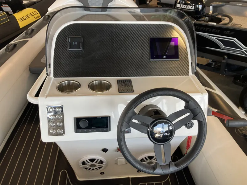 Slide: The Image of Highfield Sport 520 Rib 2025 steering console with wheel and controls. - 18