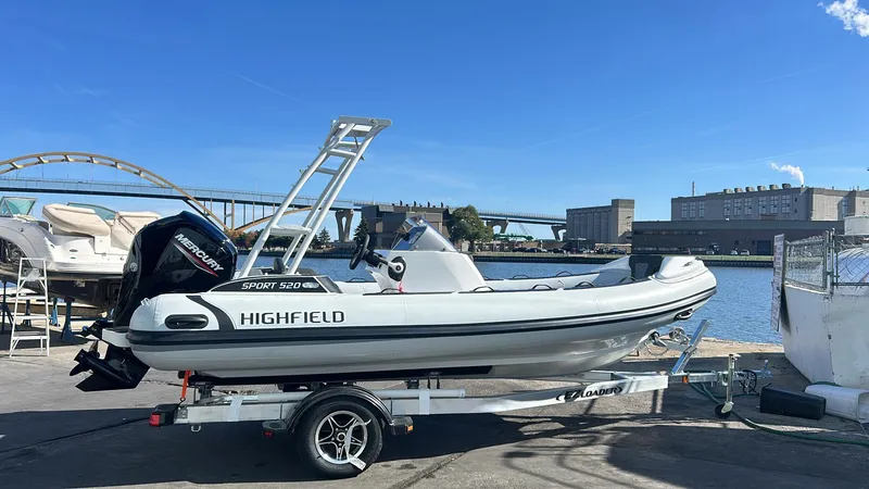 Slide: The Image of 2025 Highfield Sport 520 Rib in showroom on trailer. - 2