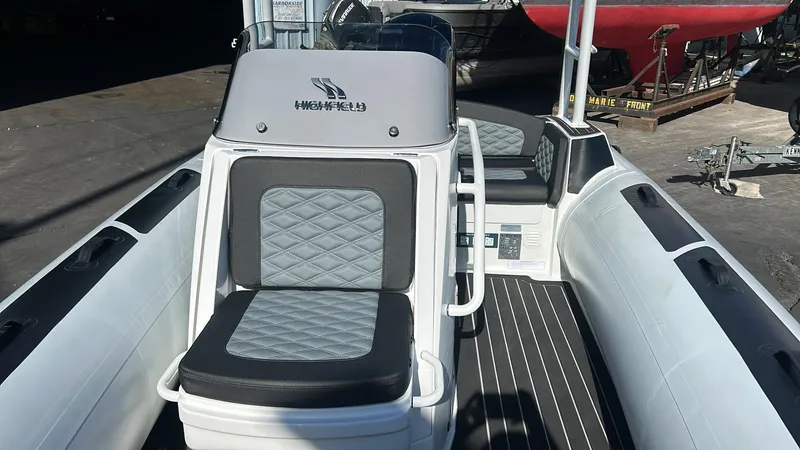 Slide: The Image of 2025 Highfield Sport 520 Rib in showroom, featuring modern design. - 4