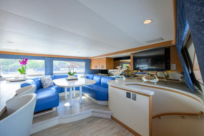 Slide: The Image of Luxurious 1998 Westport Westbay Sonship yacht interior with blue seating and modern decor. - 13