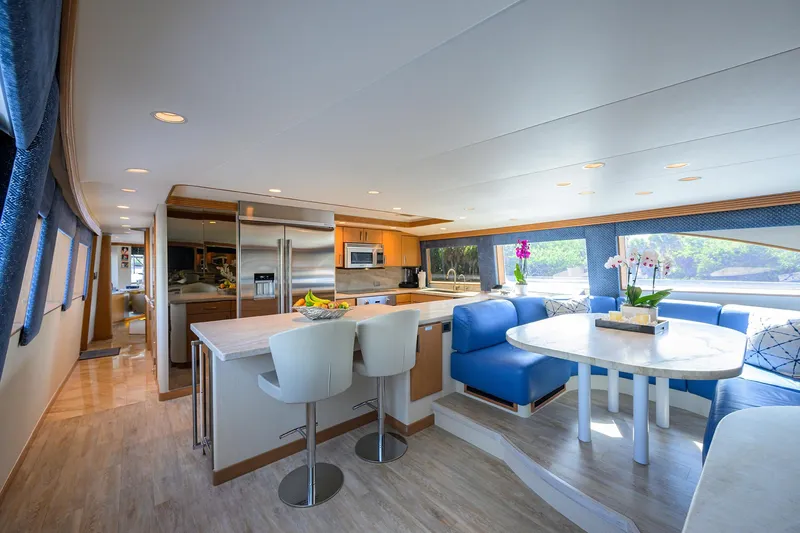 Slide: The Image of Luxurious interior of 1998 Westport Westbay Sonship yacht with modern kitchen and dining area. - 14