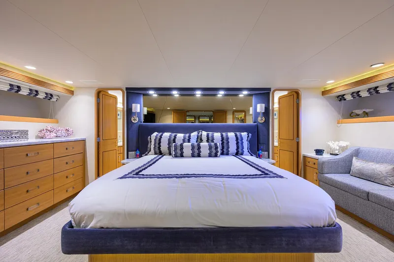Slide: The Image of Luxurious bedroom in 1998 Westport Westbay Sonship Raised Pilothouse yacht, featuring elegant decor. - 16