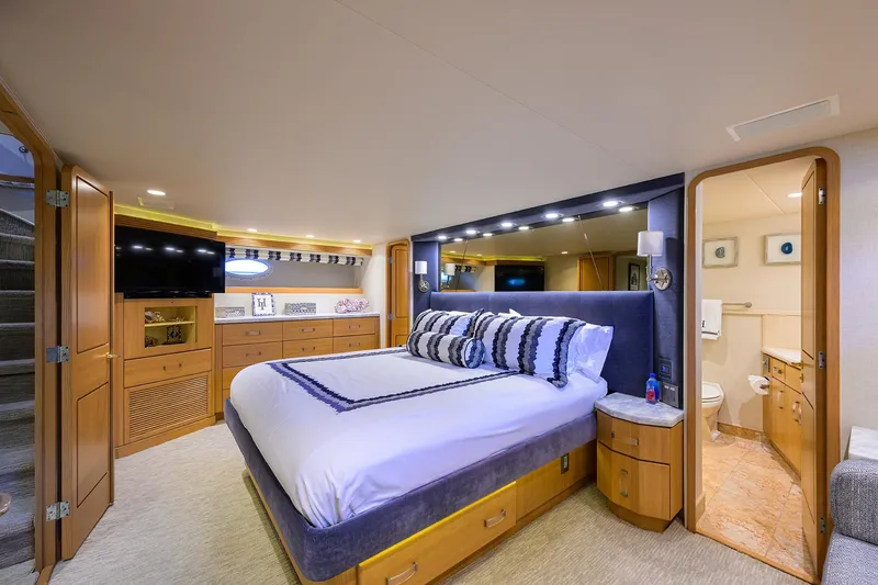 Slide: The Image of Luxurious bedroom in 1998 Westport Westbay Sonship yacht with modern decor and ensuite bathroom. - 17