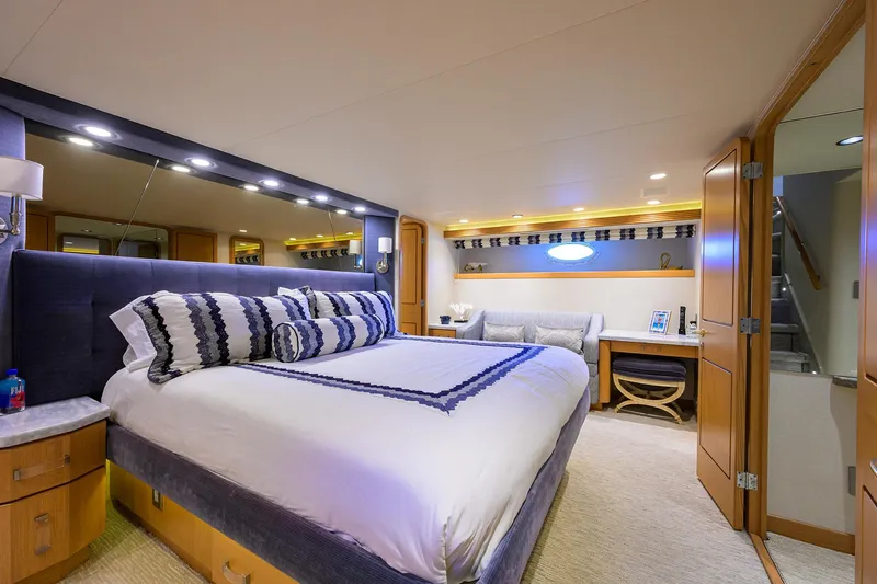 Slide: The Image of Luxurious bedroom in 1998 Westport Westbay Sonship yacht with elegant decor and modern amenities. - 19