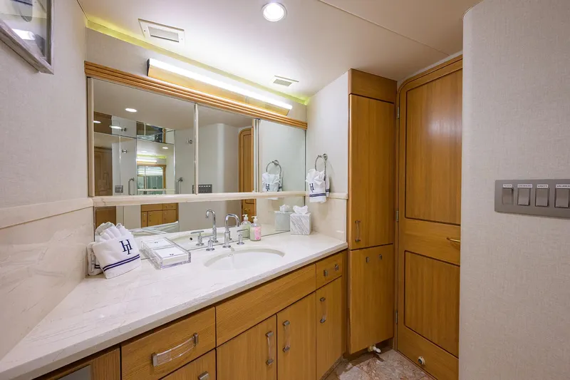 Slide: The Image of Luxurious bathroom in 1998 Westport Westbay Sonship Raised Pilothouse yacht with wooden cabinetry. - 23