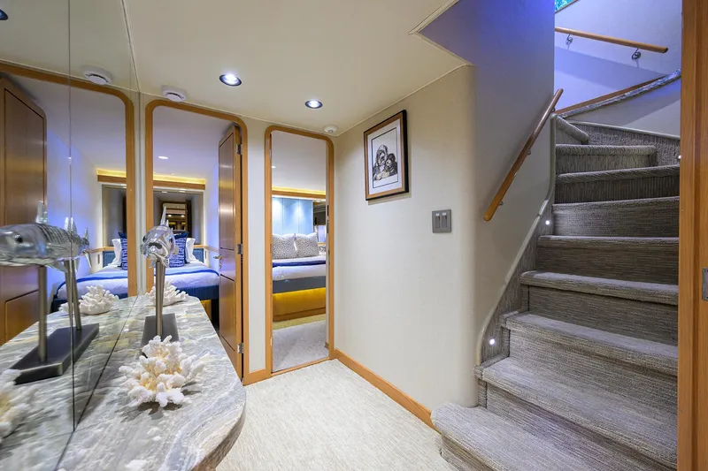 Slide: The Image of Luxurious interior of 1998 Westport Westbay Sonship yacht with elegant staircase and bedroom view. - 25