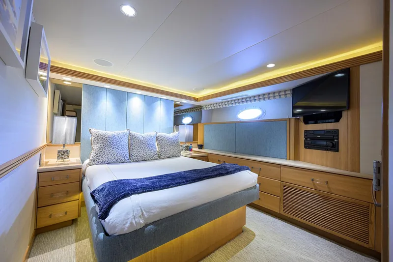 Slide: The Image of Luxurious bedroom in 1998 Westport Westbay Sonship yacht with modern decor and ambient lighting. - 26