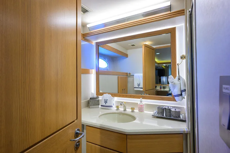 Slide: The Image of Luxurious bathroom in 1998 Westport Westbay Sonship Raised Pilothouse yacht with wood accents and modern fixtures. - 29