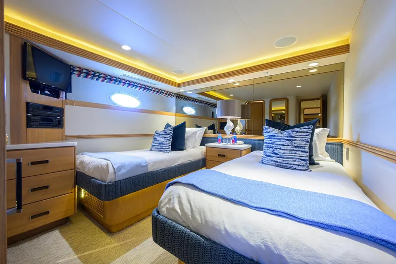 Slide: The Image of Luxurious twin cabin in 1998 Westport Westbay Sonship yacht, featuring modern decor and ambient lighting. - 31