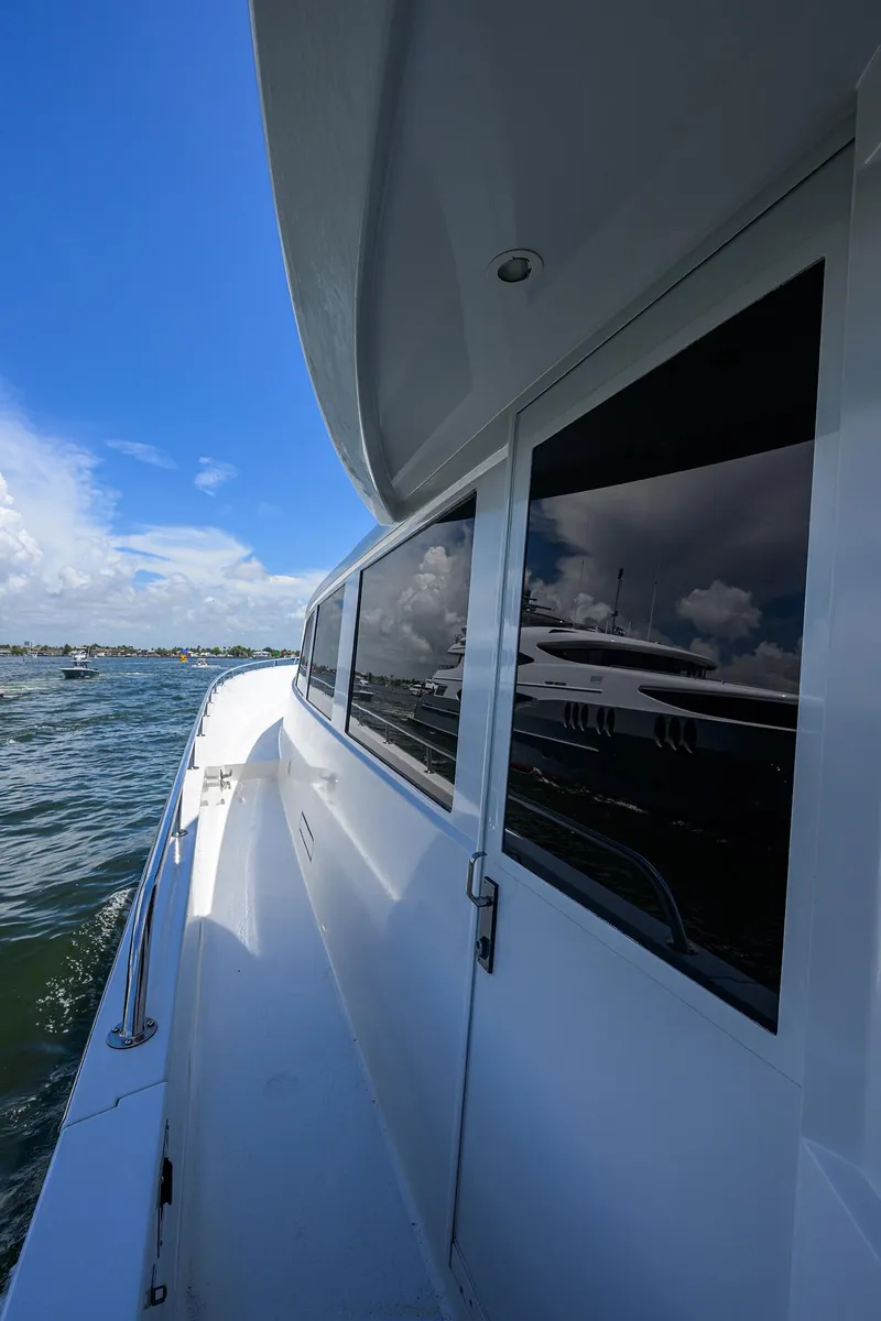 Slide: The Image of 1998 Westport Westbay Sonship Raised Pilothouse yacht, side view, on open water under blue sky. - 49