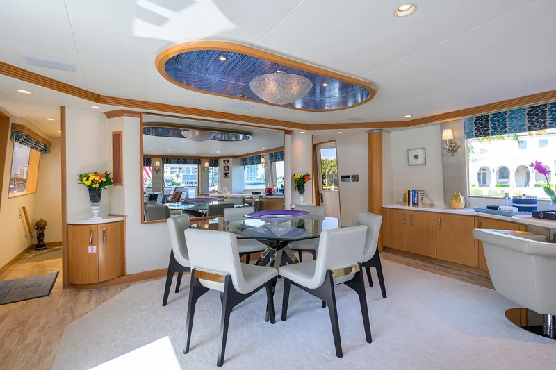 Slide: The Image of Luxurious interior of 1998 Westport Westbay Sonship yacht with elegant dining area and modern decor. - 7