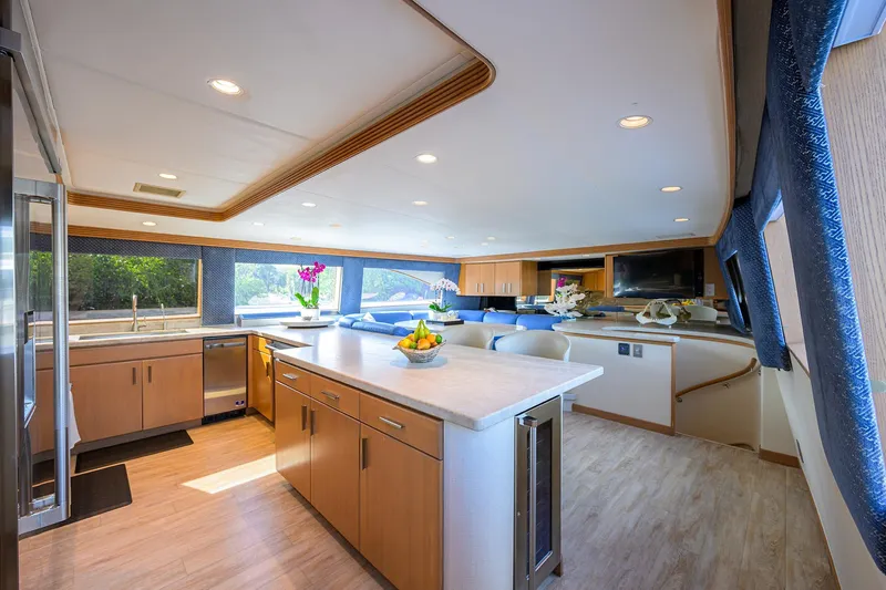 Slide: The Image of Luxurious interior of 1998 Westport Westbay Sonship Raised Pilothouse yacht with modern kitchen and seating area. - 9